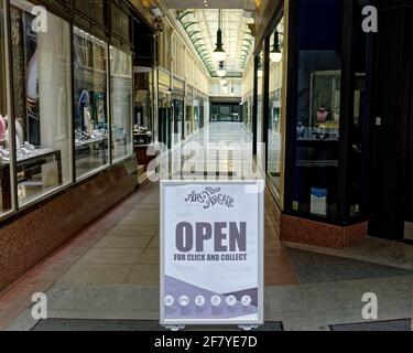 Glasgow, Scotland, UK 10th April, 2021 Lockdown Saturday saw lots of shoppers as the better weather increased the footfall in the city but the argyle arcade continues to be empty despite its hopeful sign.  Credit: Gerard Ferry/Alamy Live News Stock Photo