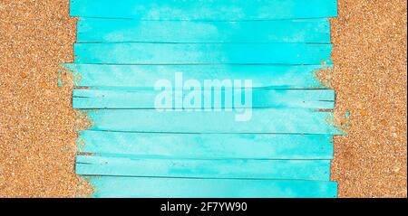 Marine banner. Turquoise horizontal wooden jetty planks with beach pebble sand. Travel and tourism. Copy space Stock Photo