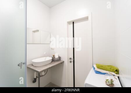 Modern twin bathroom with sinks, toilet and shower. Stock Photo