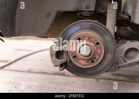 Rusty brake caliper after removing the rust, attached to a bench vise ...