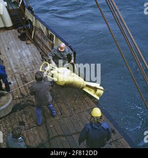 Laying current measuring equipment by a concert vessel. Stock Photo
