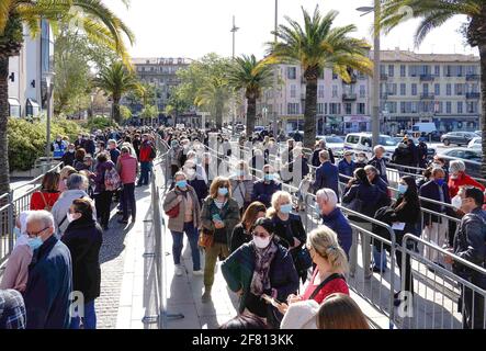 Nice, France. 10th Apr, 2021. People line up to receive the COVID-19 vaccine at a vaccination center in Nice, southern France, on April 10, 2021. France's top health regulator on Friday said people under 55 who had received the first dose of AstraZeneca's COVID-19 vaccine should complete their inoculation with a second jab of a messenger RNA (mRNA) vaccine -- such as the one developed by Pfizer-BioNTech or Moderna. Credit: Serge Haouzi/Xinhua/Alamy Live News Stock Photo