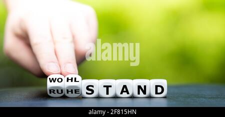 Dice form the German words "Ruhestand" (retirement) and "Wohlstand" (affluence). Stock Photo
