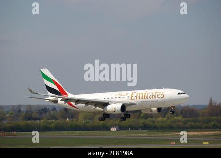 Düsseldorf, Germany - April 20, 2008: An Airbus A330-200 of Emirates Airline at the airport of Düsseldorf during final approach Stock Photo