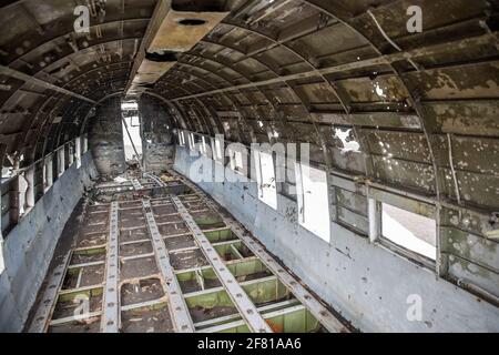interior of a textured and abandoned airplane with soft light Stock Photo