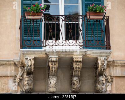 Modica Baroque balcony carvings Stock Photo