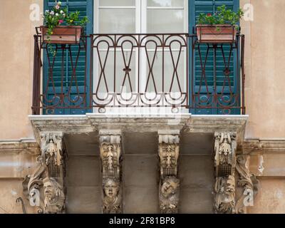 Modica Baroque balcony carvings Stock Photo