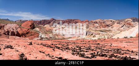 Valley of Fire State Park in Nevada during summer with black, ocher, red rocks under blue sky Stock Photo