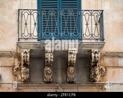 Modica Baroque balcony carvings Stock Photo