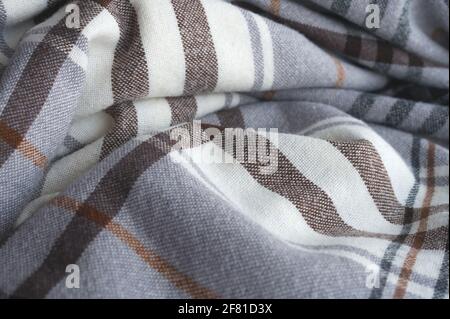 detail of a brown and beige checkered travel blanket Stock Photo