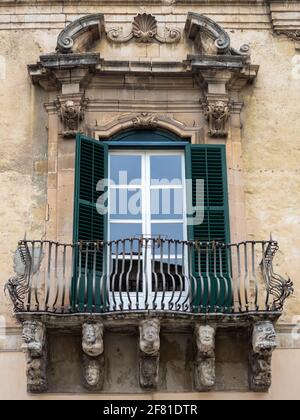 Modica Baroque balcony carvings Stock Photo