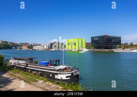 Lyon, France - August 22, 2019: The Confluence district in Lyon, city view from Saone riverbank Stock Photo