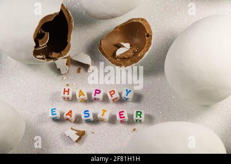 Happy Easter Broken Chocolate Candy Egg With Text Stock Photo