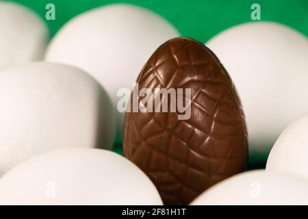 Chocolate Easter Egg With White Coated Eggs Stock Photo