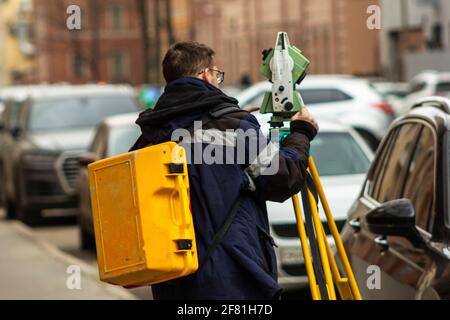 surveyor working process tachymeter measurement building construction topography of the area equipment Stock Photo