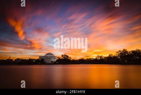 A fiery sunrise over the Tidal Basin in Washington DC featuring the Jefferson Memorial. Stock Photo