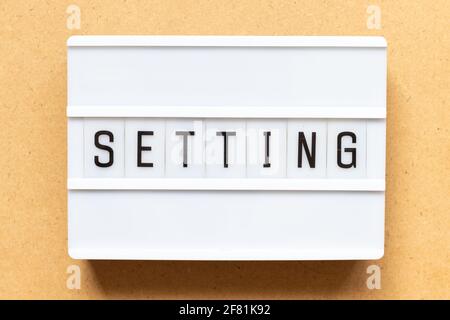 Lightbox with word setting on wood background Stock Photo