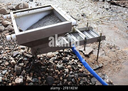 Sluce view of a sluce setup for extracting gold in a river Stock Photo