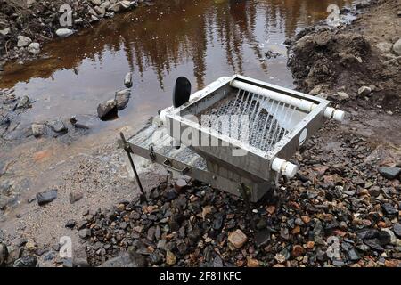 Sluce view of a sluce setup for extracting gold in a river Stock Photo