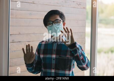 freelance man detain from society wear protective masks and unemployment at home Concept of economic crisis, people unemployment and production of Cor Stock Photo