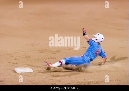 An Ole Miss Player Is Attempting to Steal Second Base In The Annual PV Challenge Softball Tournament In Puerto vallarta, Jalisco Mexico. Stock Photo