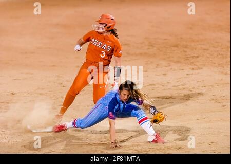 A Texas Longhorn Player Is Attempting A Stolen Base Against The Ole Miss rebels By Sliding Into Second Second Base Stock Photo