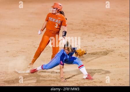 A Texas Longhorn Player Is Attempting A Stolen Base Against The Ole Miss rebels By Sliding Into Second Second Base Stock Photo