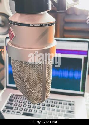 SAEGERTOWN, PA, UNITED STATES - Apr 07, 2021: Neumann TLM 103 Microphone with MacBook Pro.  In my home studio recording a voiceover for a client Stock Photo