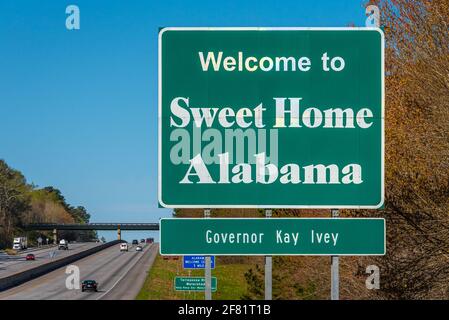 Welcome to Sweet Home Alabama sign along I-20 near the Georgia-Alabama state line in Cleburne County, Alabama. (USA) Stock Photo