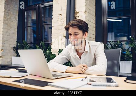 businessman working on laptop in office Stock Photo