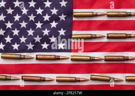 Bullet ammunition on a United states stars and stripes flag Stock Photo