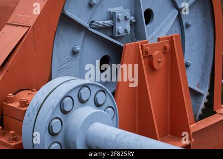 Close-up of a large orange mechanical part Stock Photo