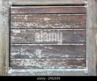 Horizontal panels of heavily weathered wood in a square frame Stock Photo
