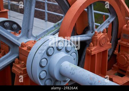 Close-up of a large orange mechanical part Stock Photo