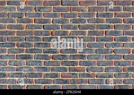 Abstract of a red and purple brick wall background Stock Photo