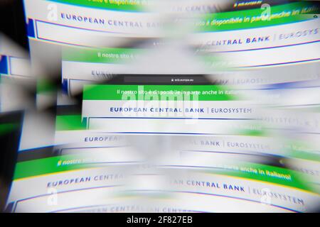 Milan, Italy - APRIL 10, 2021: European Central Bank logo on laptop screen seen through an optical prism, creative interpretation. Dynamic and unique Stock Photo