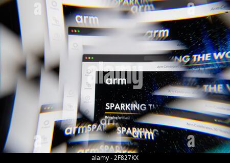 Milan, Italy - APRIL 10, 2021: ARM Holdings logo on laptop screen seen through an optical prism, creative interpretation. Dynamic and unique image fro Stock Photo