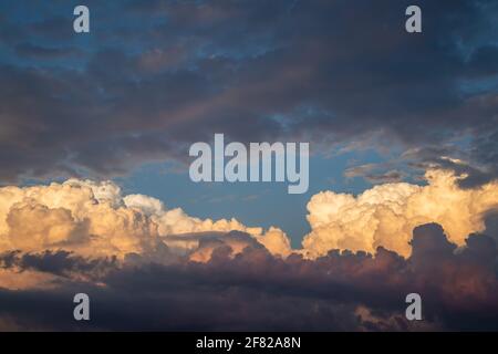 Cumulonimbus during sunset. Dramatic sky before storm. Top of cumulus clouds Stock Photo