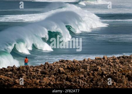 A set of waves breaking at the Bordeira Beach (Praia da Bordeira) in Algarve, Portugal Stock Photo