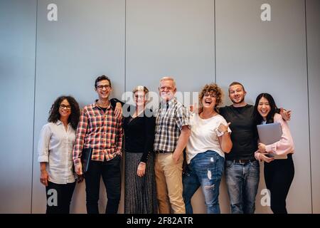 Group of multi-ethnic business people standing together and looking at camera. business team posing for a group portrait. Stock Photo