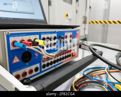 Testing electrical power plant protection and control cubicles. Stock Photo