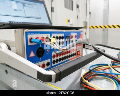 Testing electrical power plant protection and control cubicles. Stock Photo