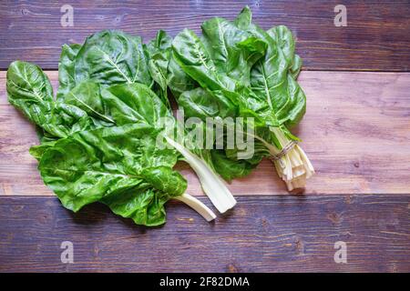 Balkan cuisine. Blitva ( chard leaves ) - popular leafy vegetables. Rustic background, space for text Stock Photo