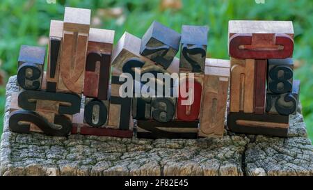 letters and numbers, wooden typefaces stacked at random Stock Photo