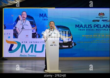 Kota Bharu, Malaysia's northern Kelantan state. 11th Apr, 2021. Malaysian Transport Minister Wee Ka Siong speaks at the ceremony to launch the Diesel Multiple Unit trains in Kota Bharu, the capital of Malaysia's northern Kelantan state, April 11, 2021. The Diesel Multiple Unit (DMU) trains manufactured by China Railway Rolling Stock Corporation (CRRC) Zhuzhou Electric Locomotive Co., Ltd were launched into operations on Sunday, which will boost connectivity and facilitate travel in Malaysia's eastern coast area. Credit: Zhu Wei/Xinhua/Alamy Live News Stock Photo