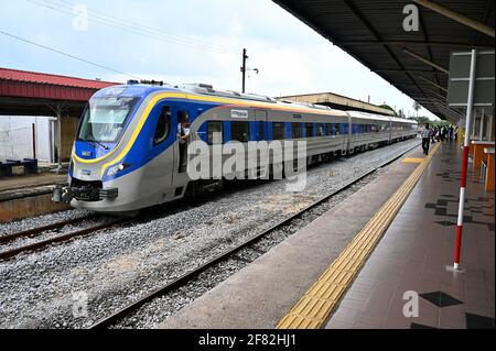 Kota Bharu, Malaysia's northern Kelantan state. 11th Apr, 2021. The Diesel Multiple Unit train arrives at a station in Kota Bharu, the capital of Malaysia's northern Kelantan state, April 11, 2021. The Diesel Multiple Unit (DMU) trains manufactured by China Railway Rolling Stock Corporation (CRRC) Zhuzhou Electric Locomotive Co., Ltd were launched into operations on Sunday, which will boost connectivity and facilitate travel in Malaysia's eastern coast area. Credit: Zhu Wei/Xinhua/Alamy Live News Stock Photo