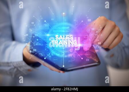 Businessman holding a foldable smartphone, new business concept