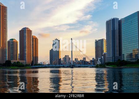 Beautiful scene of Sumida river with famous Chuo-Ohashi Bridge and Okawabata Rivercity and modern Tsukishima district Tokyo, Japan, travel background Stock Photo