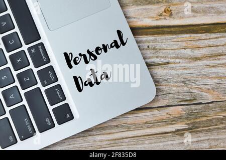 Top view of laptop written with text PERSONAL DATA. Stock Photo