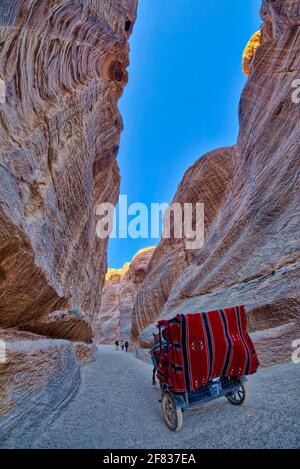 The Siq, the main road that leads to the city, starts from the Dam and ends at the Treasury.  It is a rock canal that measures 160 meters in length, 3 Stock Photo